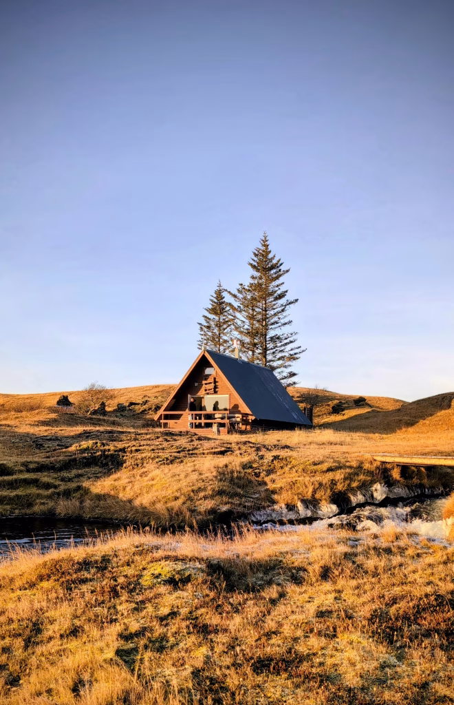 A-frame cabin nestled in a golden landscape A-frame cabin nestled in a golden landscape